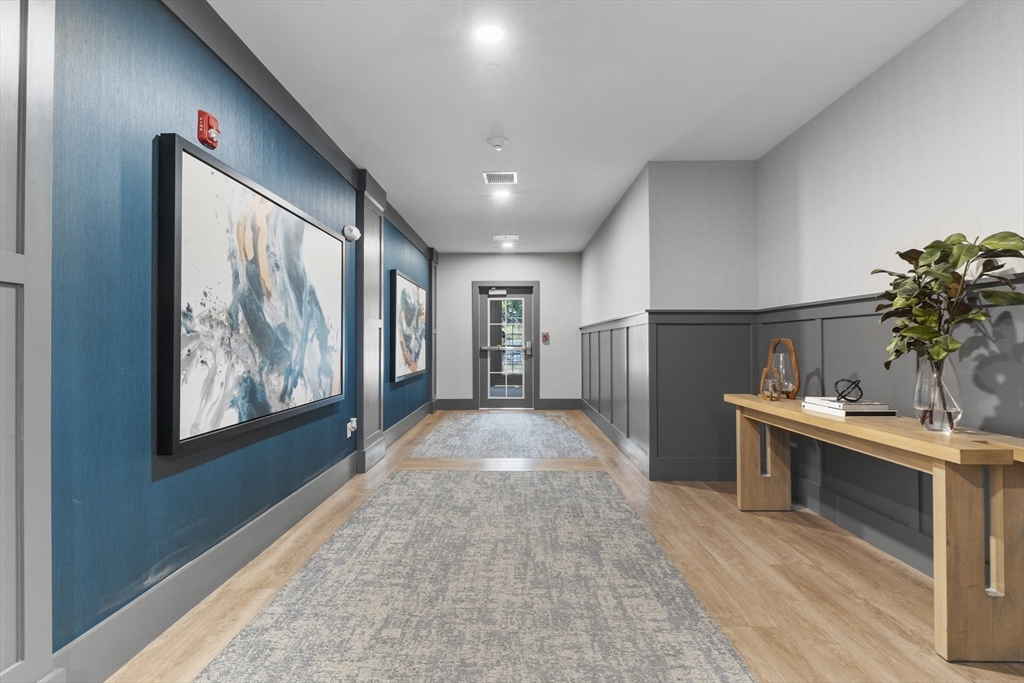 60 Coppersmith Way, Unit 304 Canton, MA 02021 - Photo 24 of 42 a view of livingroom with washer and dryer