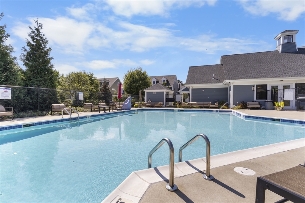 60 Coppersmith Way, Unit 304 Canton, MA 02021 - Photo 37 of 42 a view of a lake with a house