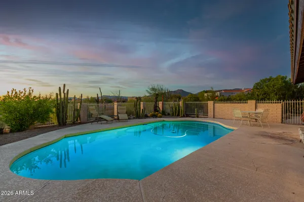 a view of a swimming pool with an ocean view