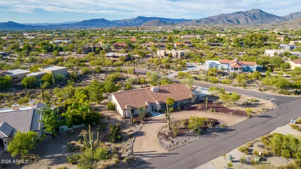 an aerial view of residential houses with outdoor space