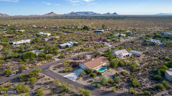 an aerial view of residential house with outdoor space and lake view