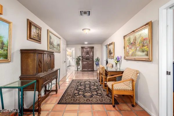 a living room with furniture and a rug