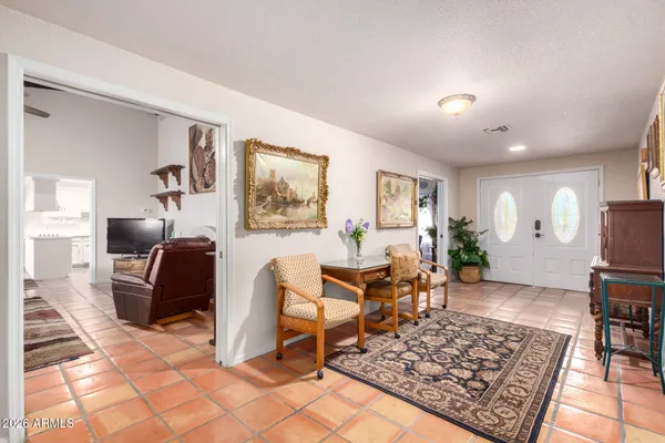 a living room with furniture and a rug