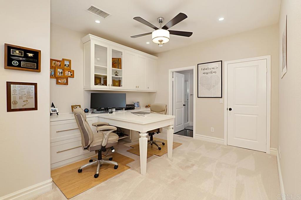 7657 Sitio Algodon Carlsbad, CA 92009 - Photo 19 of 40 a view of a livingroom with furniture and a ceiling fan