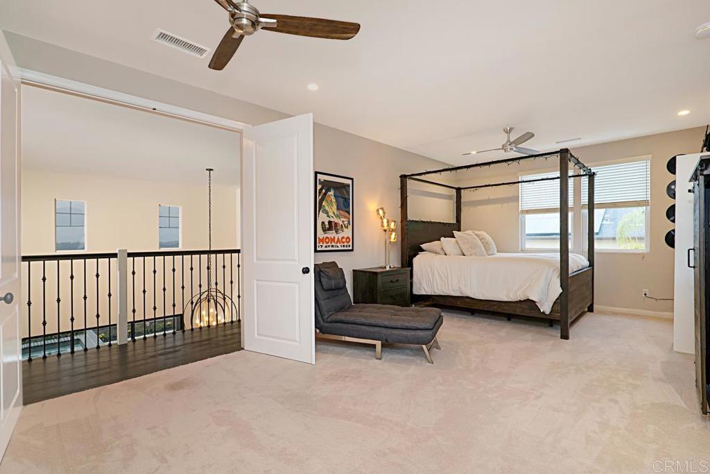7657 Sitio Algodon Carlsbad, CA 92009 - Photo 32 of 40 a bedroom with bed and window