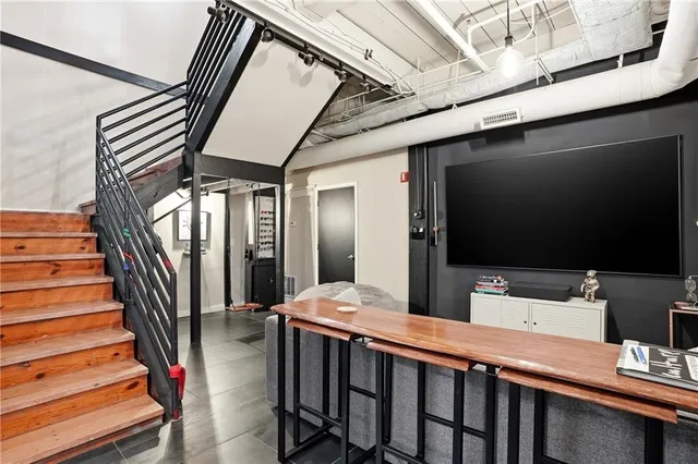 a room with furniture and a flat screen tv