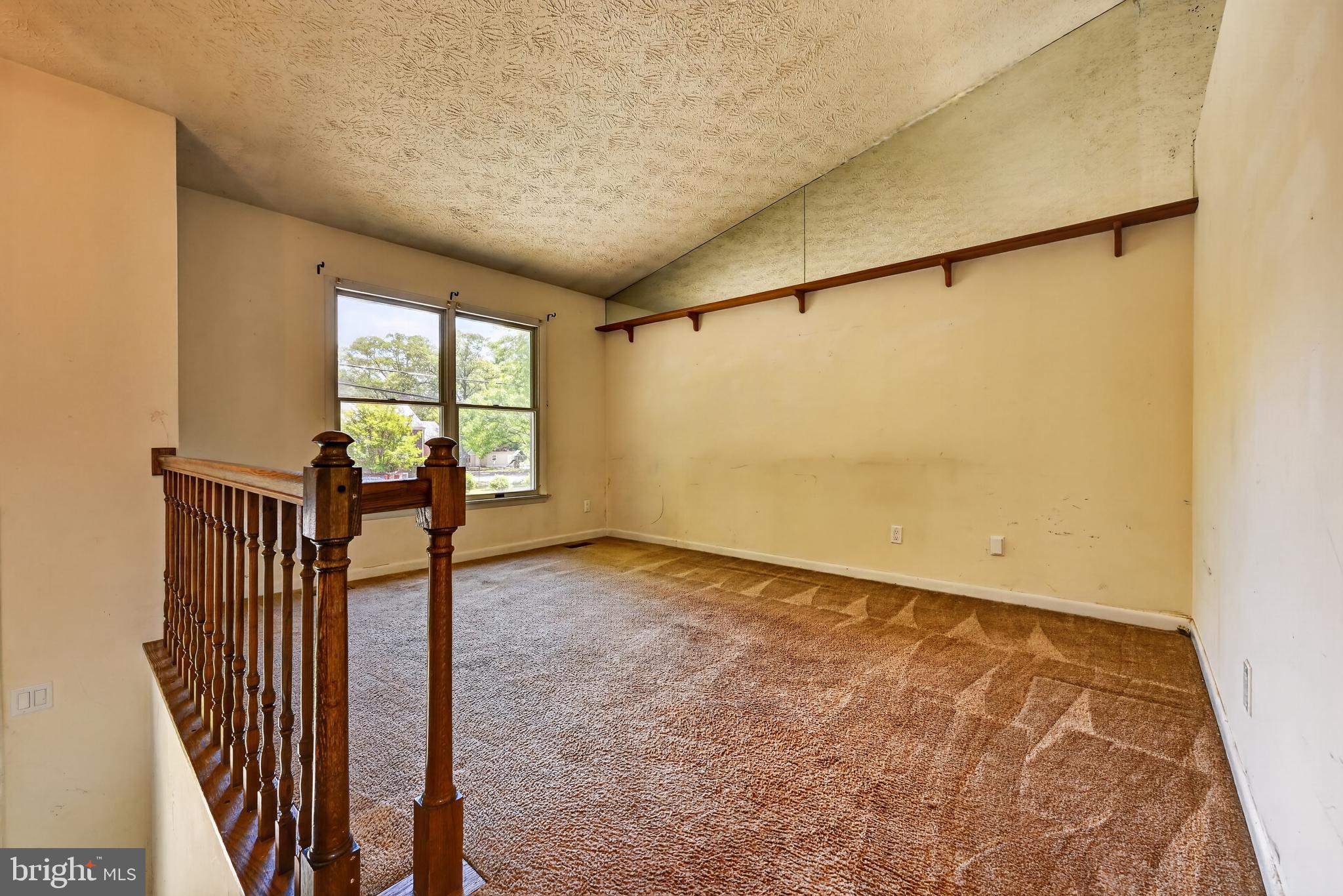 7838 Tick Neck Road Pasadena, MD 21122 - Photo 15 of 20 an empty room with windows