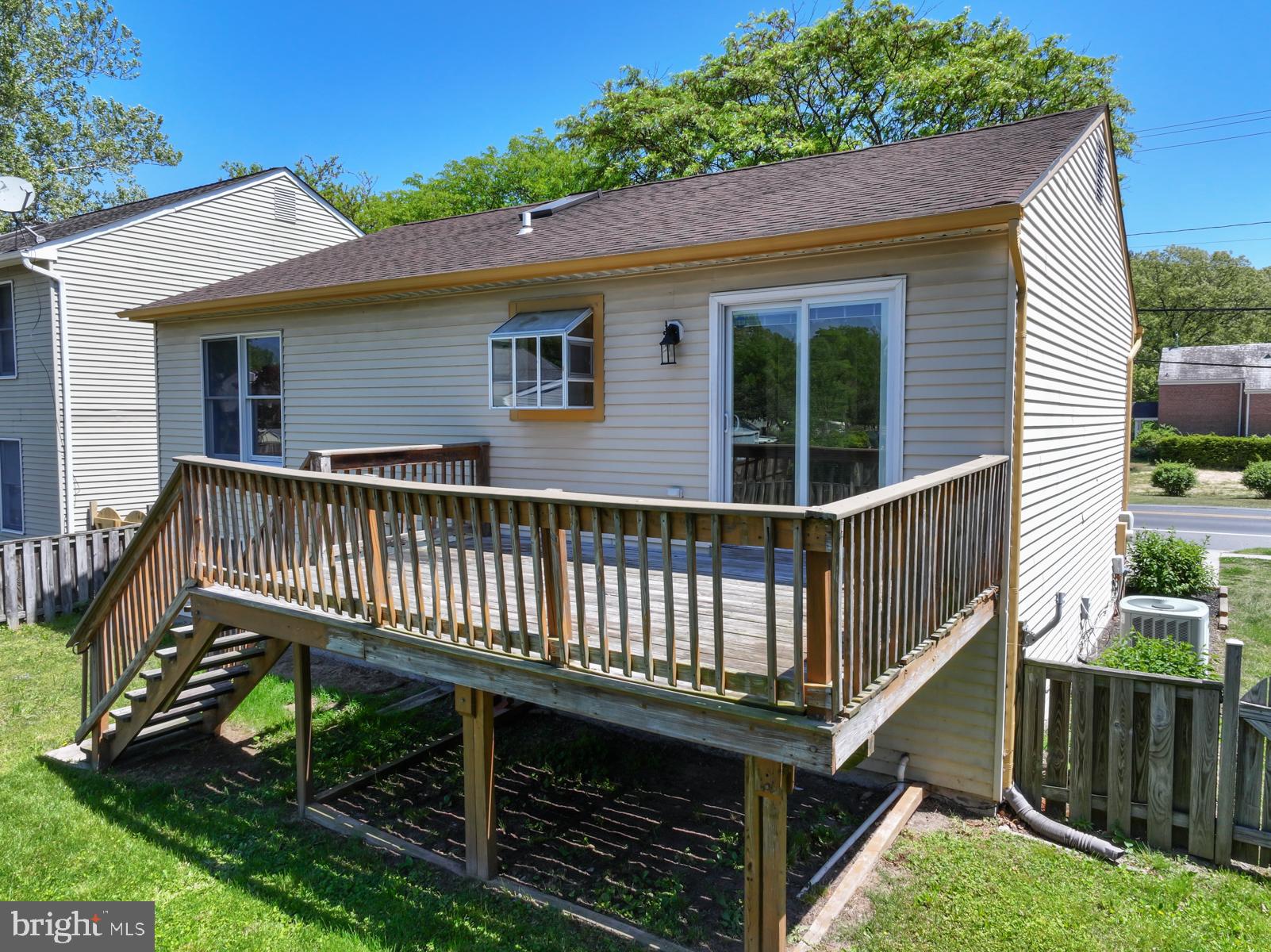 7838 Tick Neck Road Pasadena, MD 21122 - Photo 6 of 20 a view of a house with wooden fence