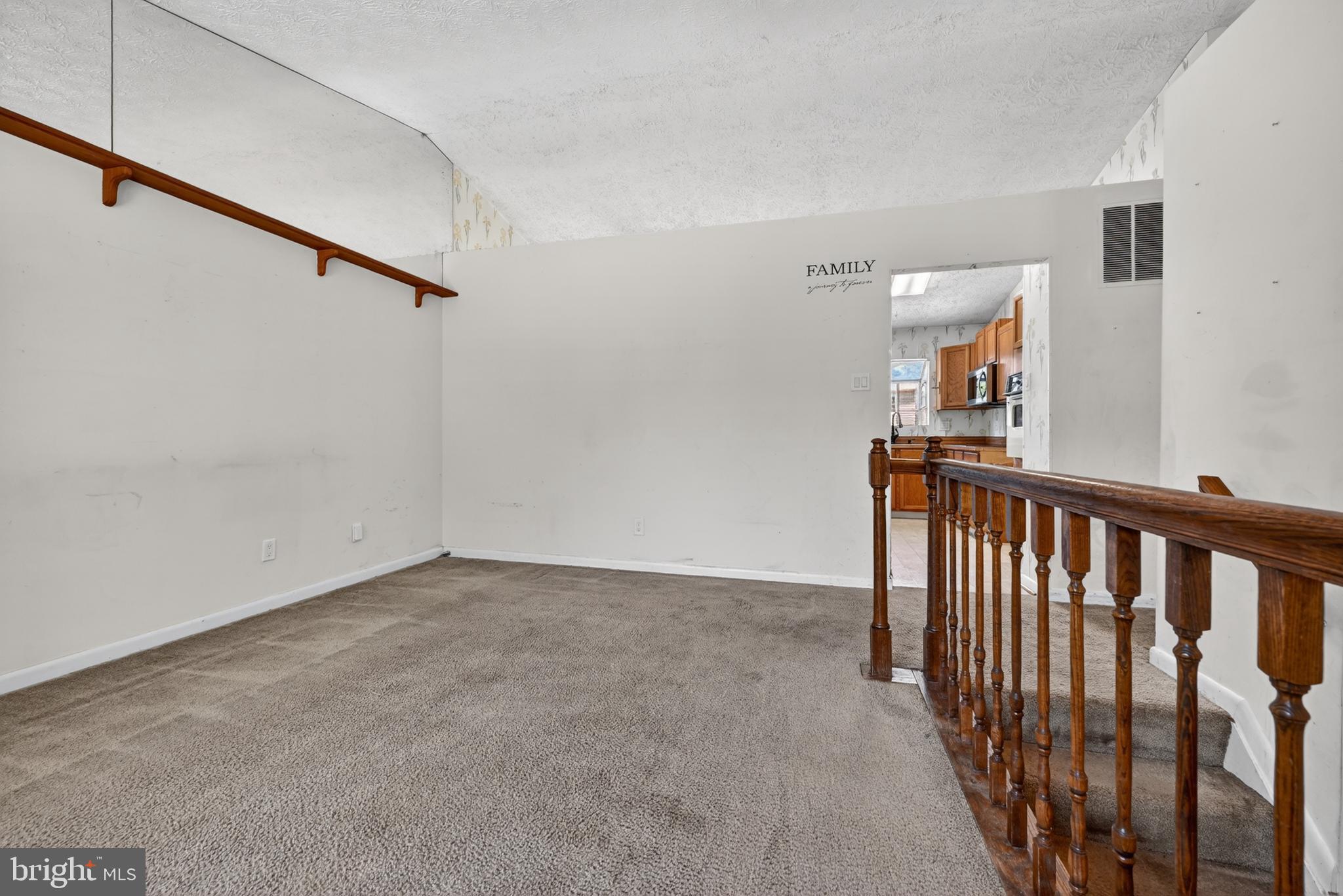 7838 Tick Neck Road Pasadena, MD 21122 - Photo 9 of 20 a view of a hallway with wooden floor and entryway
