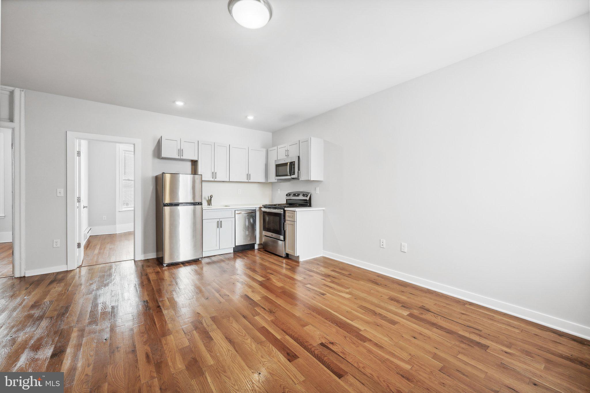 4300 Chestnut Street, Unit 1 Philadelphia, PA 19104 - Photo 1 of 30 a view of kitchen with wooden floor