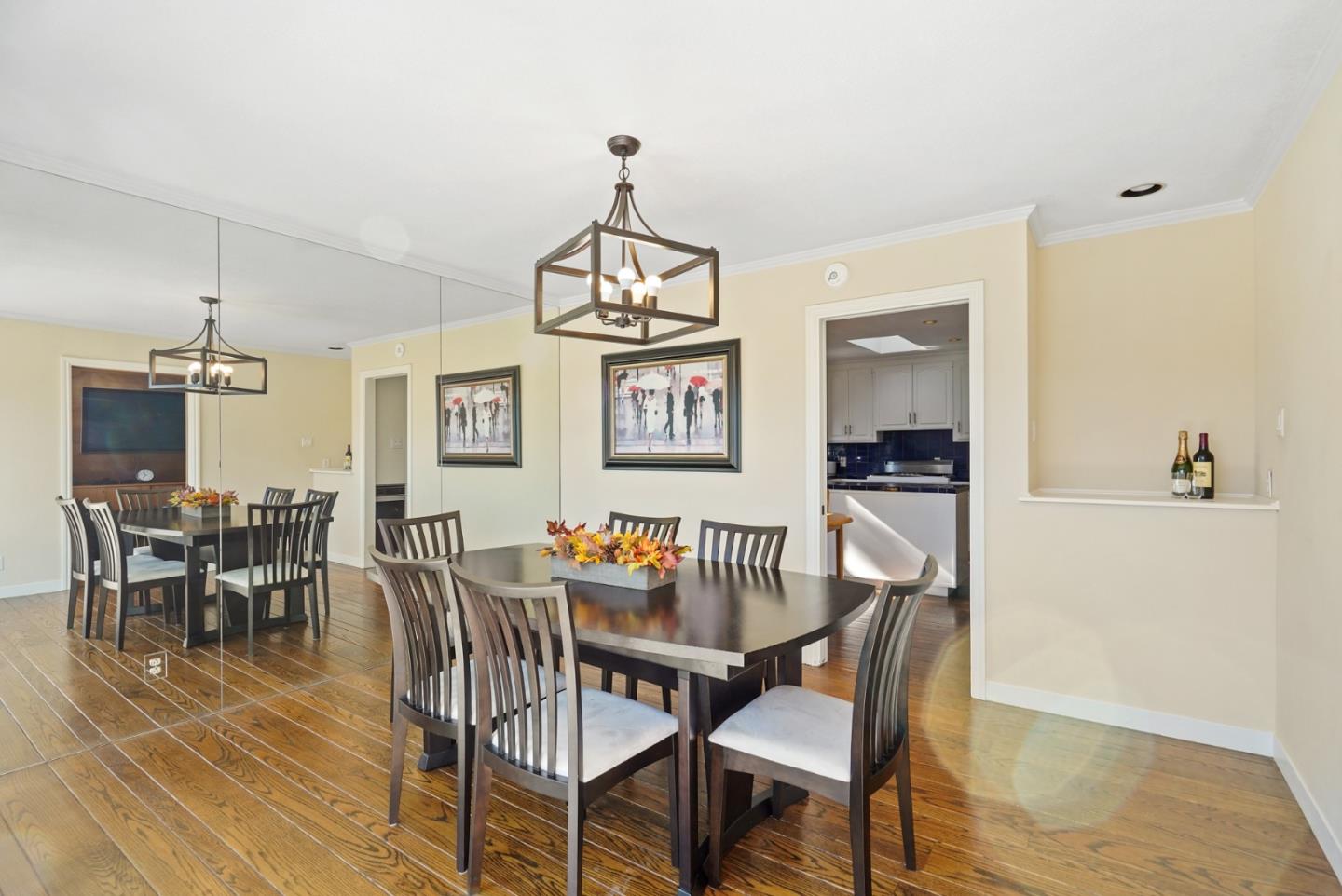 4015 Marsten Avenue Belmont, CA 94002 - Photo 12 of 53 a dining room with wooden floor a chandelier a wooden table and chairs