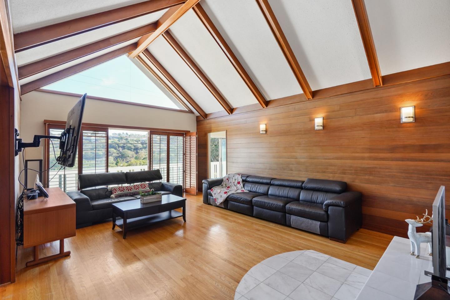 4015 Marsten Avenue Belmont, CA 94002 - Photo 17 of 53 a living room with furniture and a floor to ceiling window