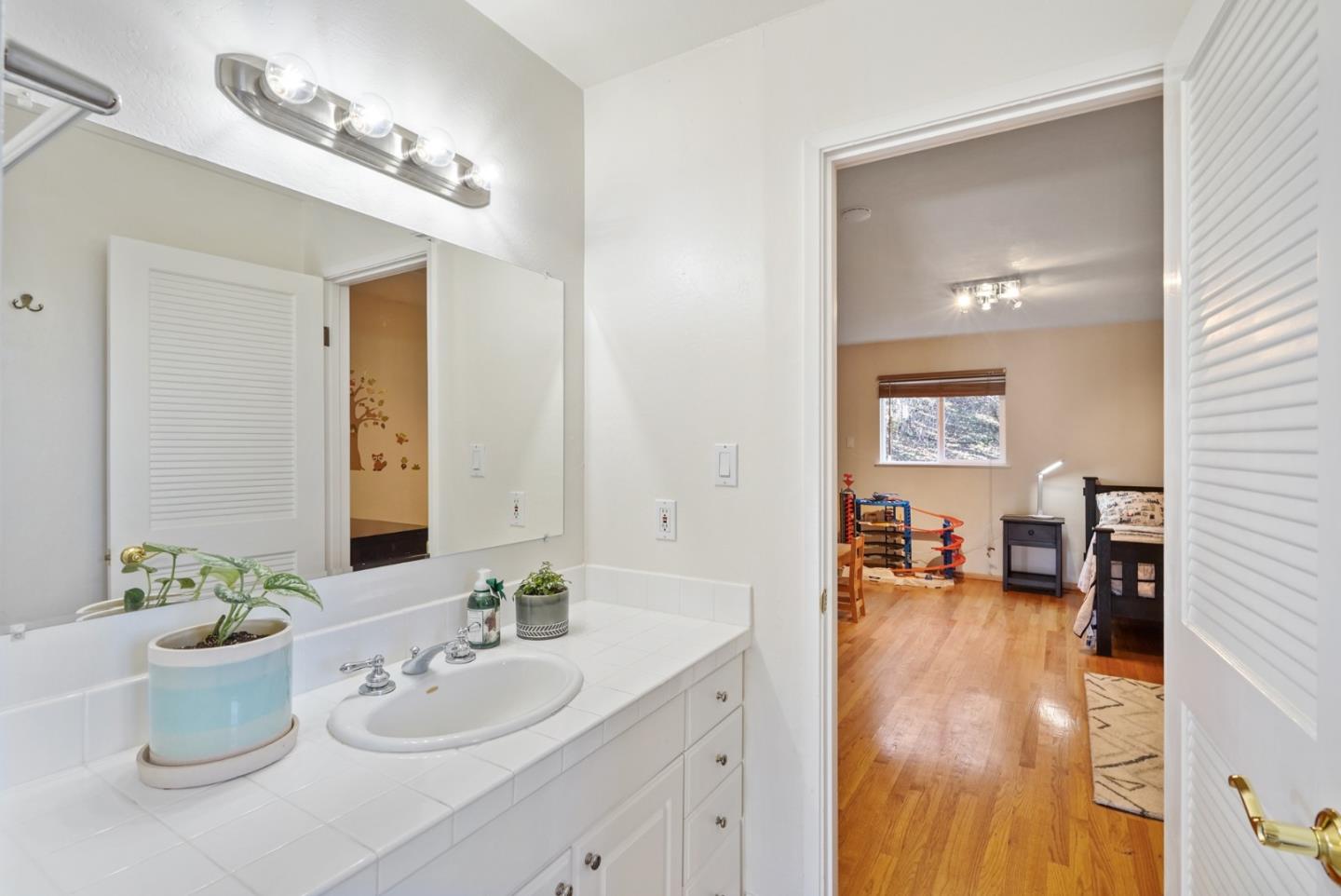 4015 Marsten Avenue Belmont, CA 94002 - Photo 25 of 53 a bathroom with a sink and a mirror