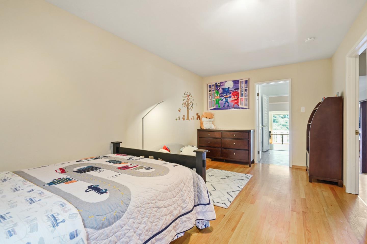 4015 Marsten Avenue Belmont, CA 94002 - Photo 28 of 53 a bedroom with a bed and a couch