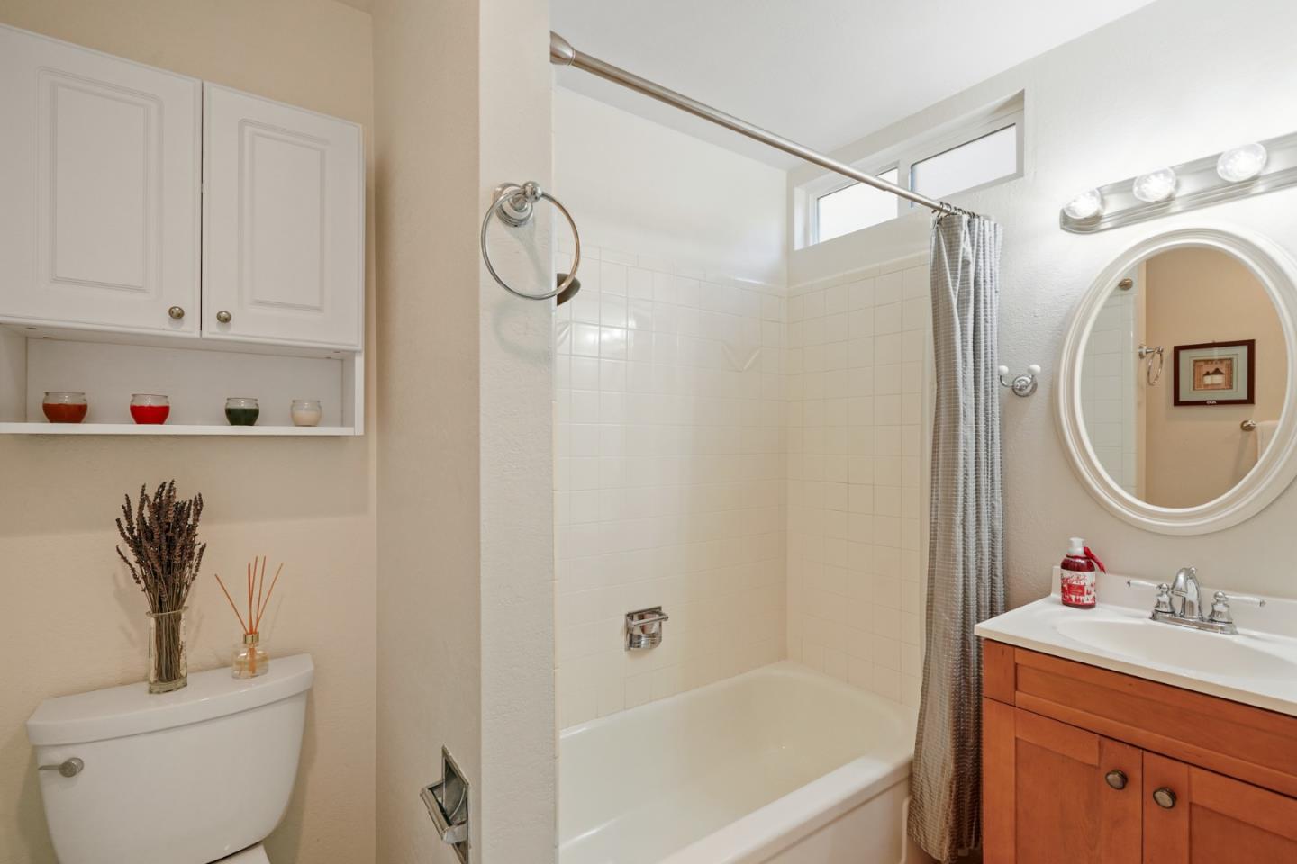 4015 Marsten Avenue Belmont, CA 94002 - Photo 33 of 53 a bathroom with a granite countertop sink toilet and shower
