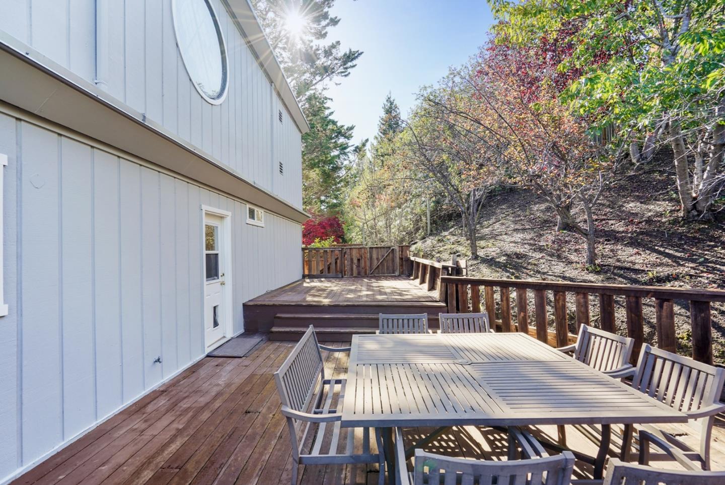 4015 Marsten Avenue Belmont, CA 94002 - Photo 36 of 53 a view of a patio with table and chairs with wooden floor and fence
