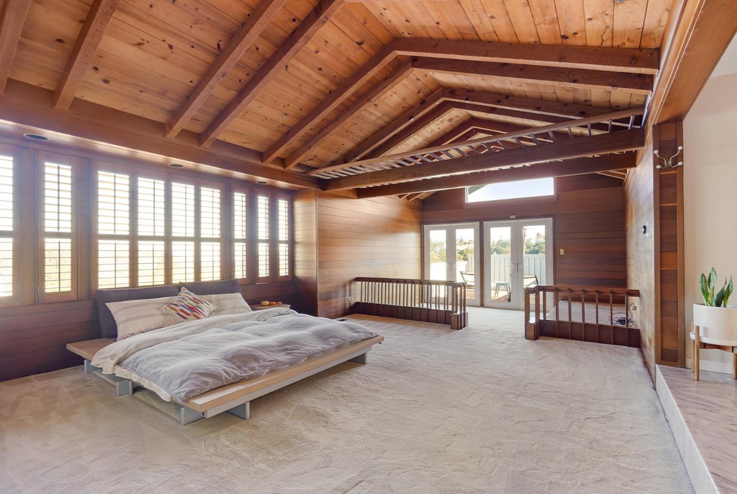 4015 Marsten Avenue Belmont, CA 94002 - Photo 41 of 53 a spacious bedroom with a bed a couch and a large window