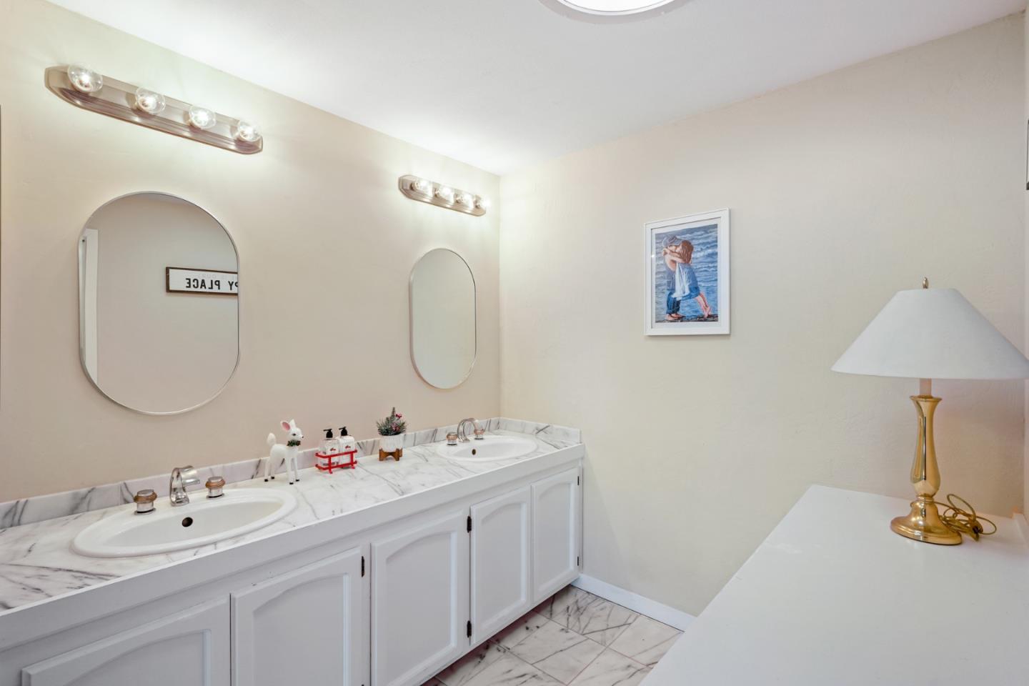 4015 Marsten Avenue Belmont, CA 94002 - Photo 50 of 53 a bathroom with a double vanity sink and a mirror