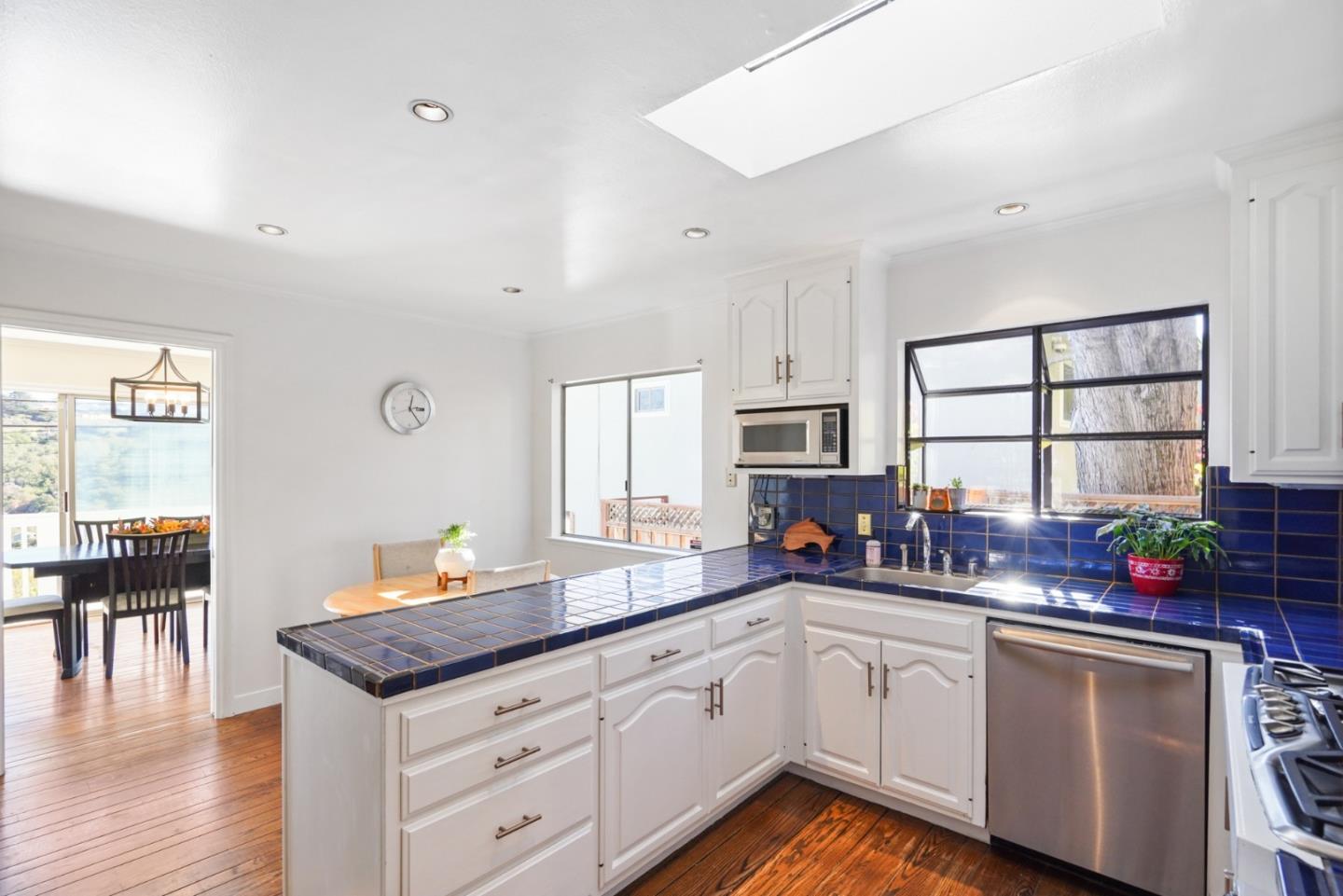 4015 Marsten Avenue Belmont, CA 94002 - Photo 8 of 53 a kitchen with sink stove and cabinets