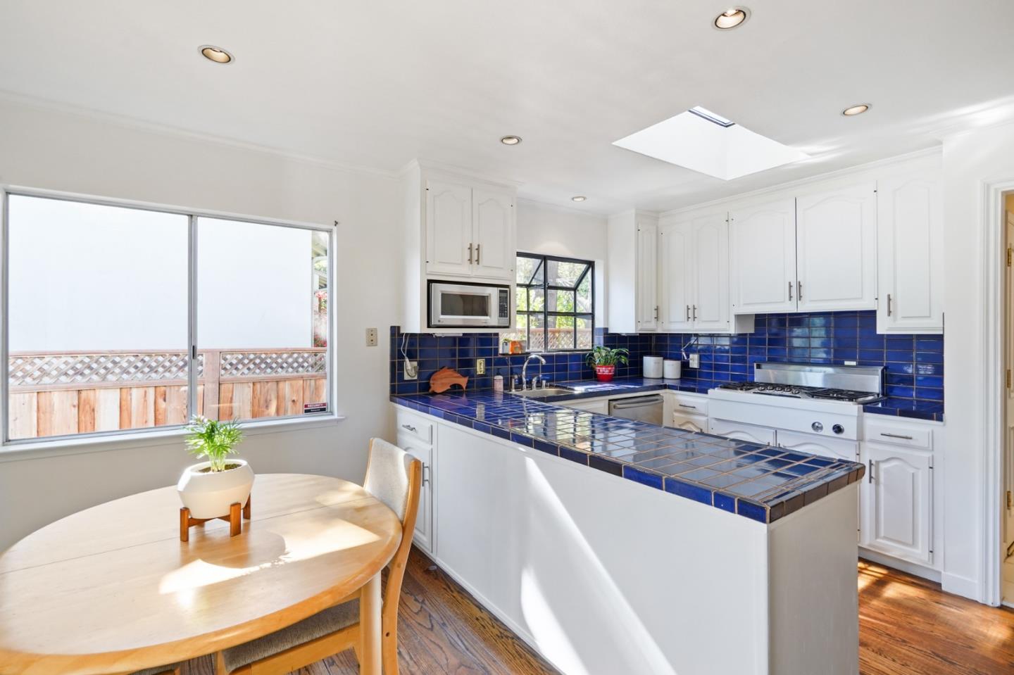 4015 Marsten Avenue Belmont, CA 94002 - Photo 9 of 53 a kitchen with stainless steel appliances granite countertop a sink a stove and a refrigerator