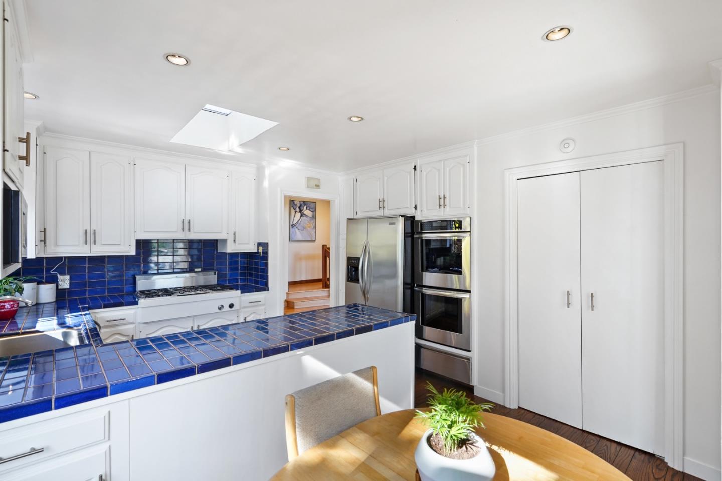 4015 Marsten Avenue Belmont, CA 94002 - Photo 10 of 53 a kitchen with stainless steel appliances a refrigerator and a stove top oven