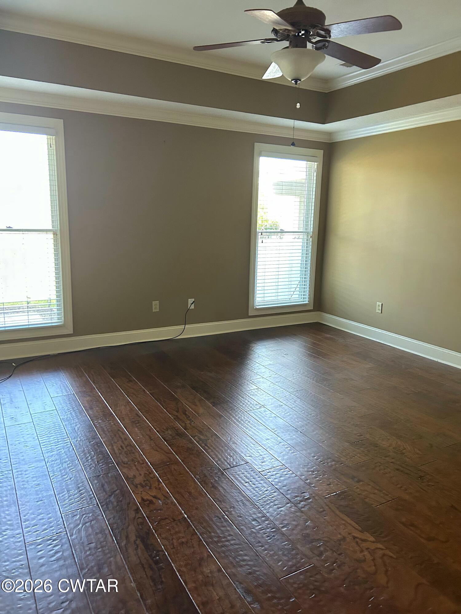 129 Quail Ridge Jackson, TN 38305 - Photo 14 of 35 an empty room with wooden floor and windows