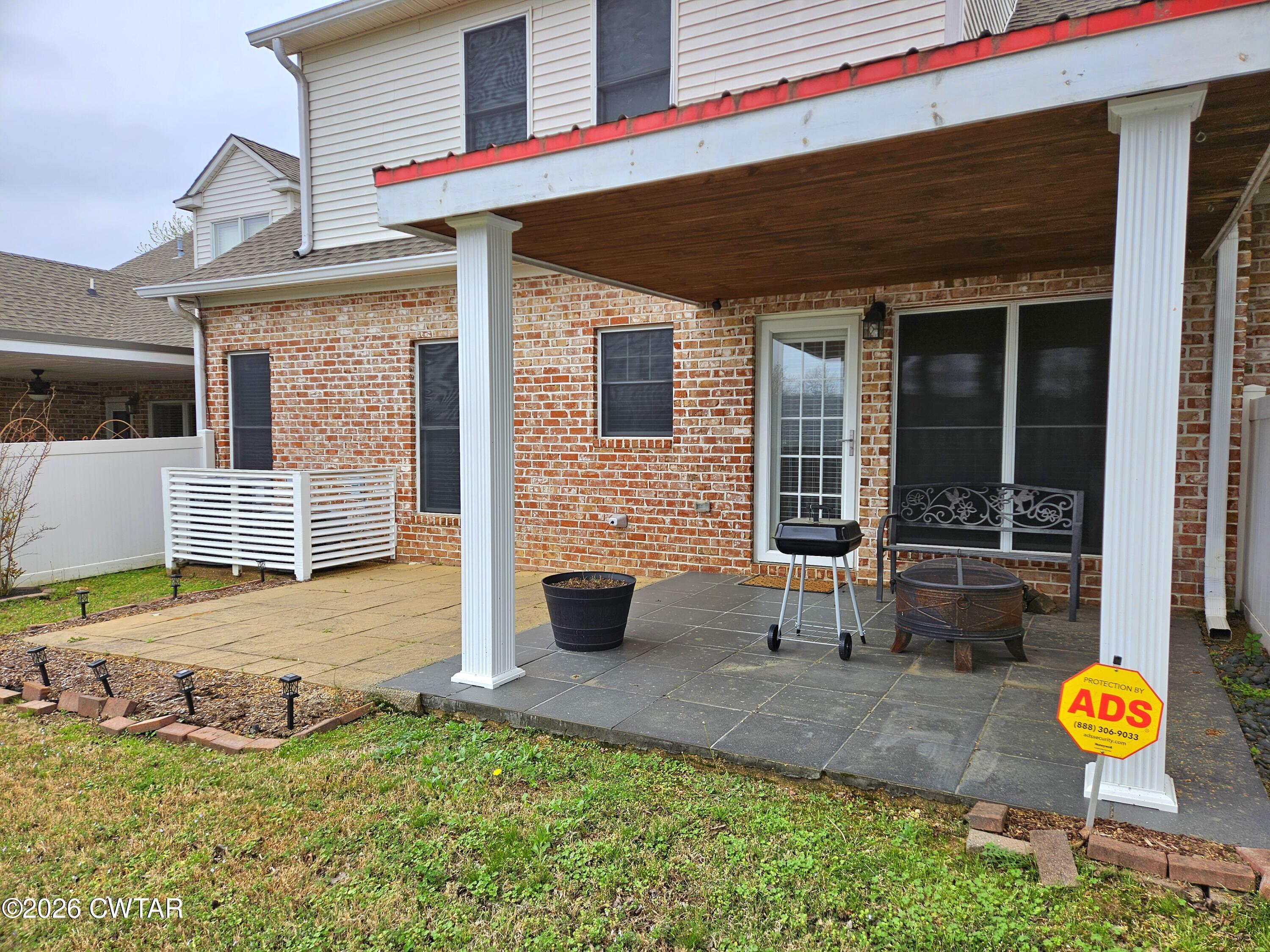 129 Quail Ridge Jackson, TN 38305 - Photo 27 of 35 a front view of a house with patio
