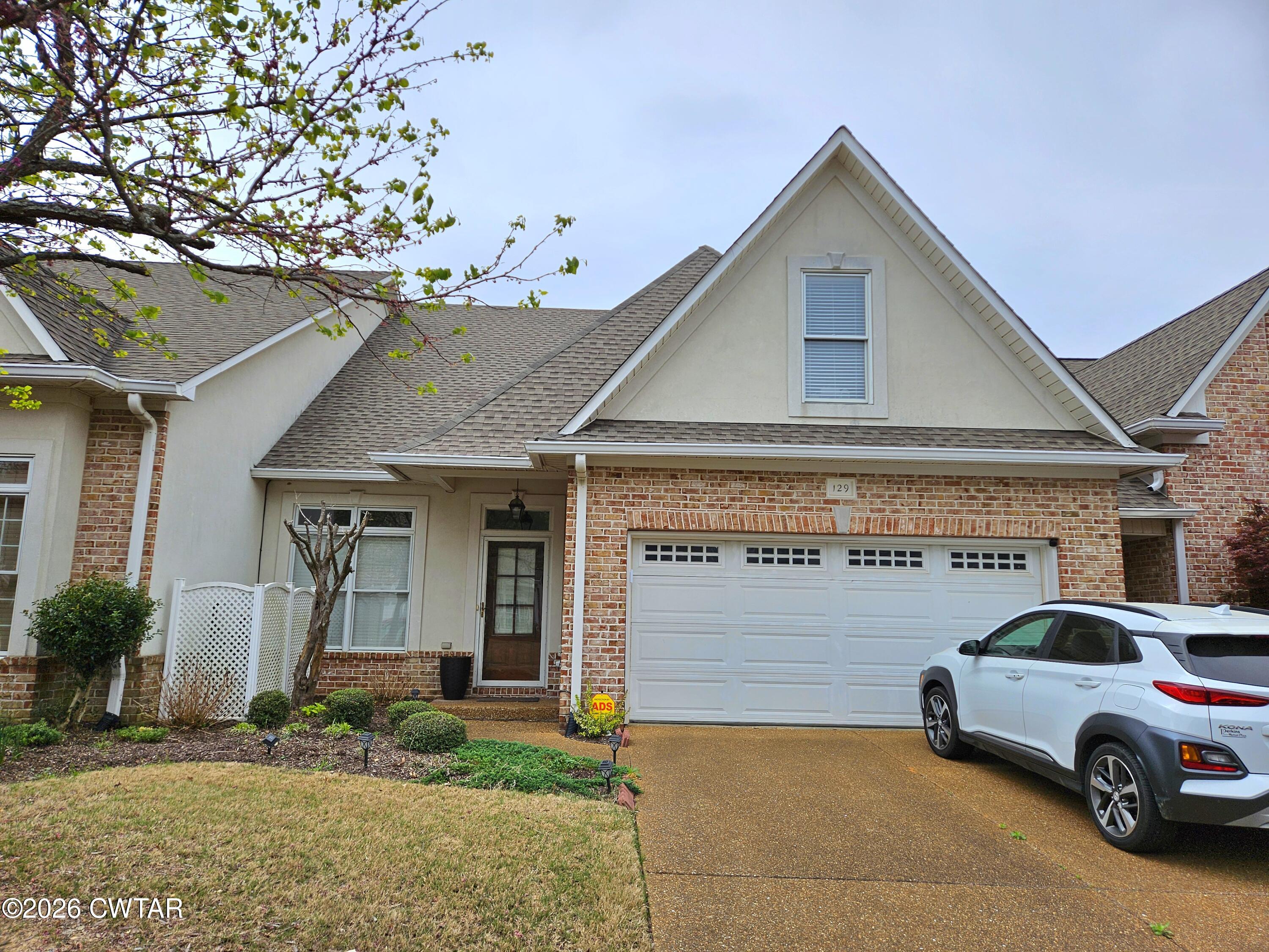 129 Quail Ridge Jackson, TN 38305 - Photo 35 of 35 a front view of a house with parking