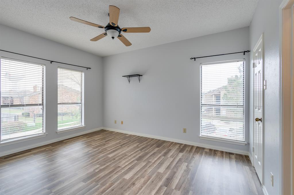 2100 Randy Snow Road, Unit 412 Arlington, TX 76011 - Photo 23 of 32 a view of empty room with wooden floor and fan