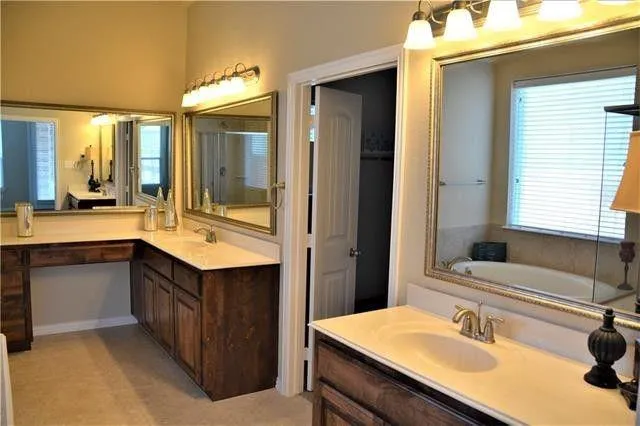 a bathroom with a bathtub and a sink