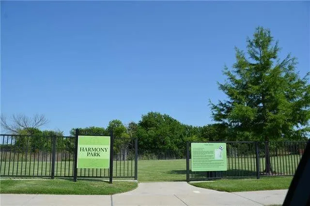 a view of a brick house with large windows