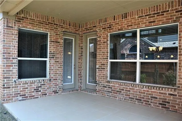 a view of a house with a door and wooden floor