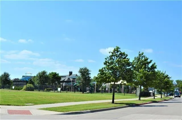 a view of a lake with table and chairs