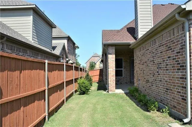a view of a house with wooden walls