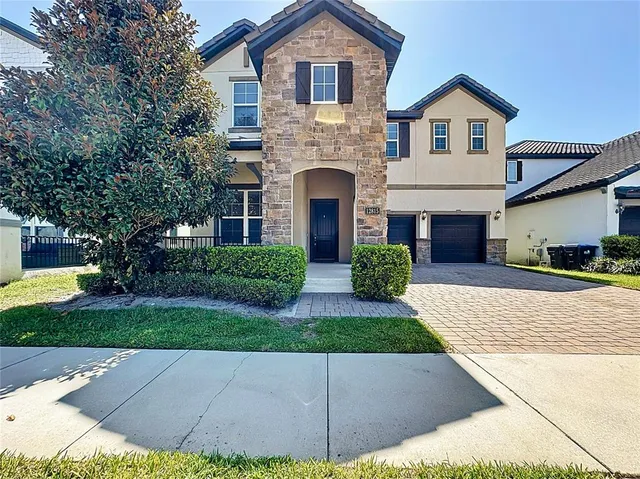 a front view of a house with garden