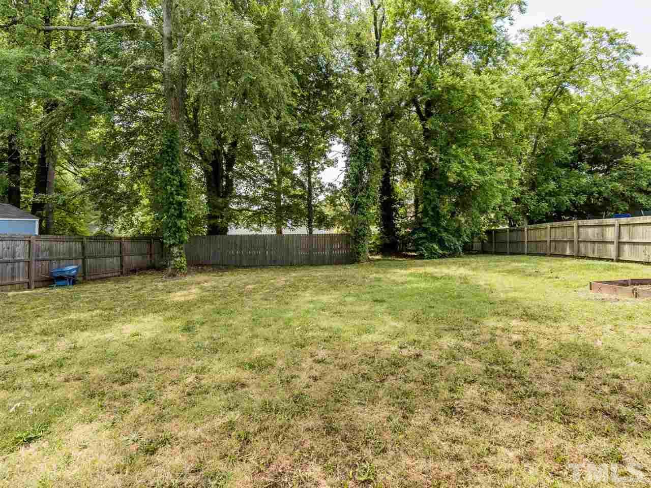 2308 Milburnie Road Raleigh, NC 27610 - Photo 22 of 25 a view of outdoor space with deck and trees