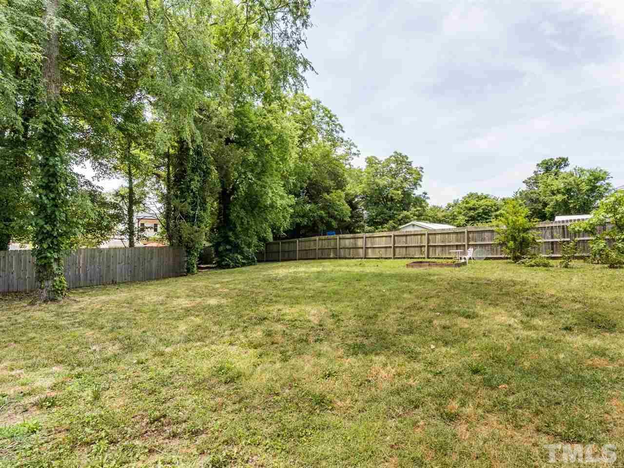 2308 Milburnie Road Raleigh, NC 27610 - Photo 23 of 25 a view of a yard with a house