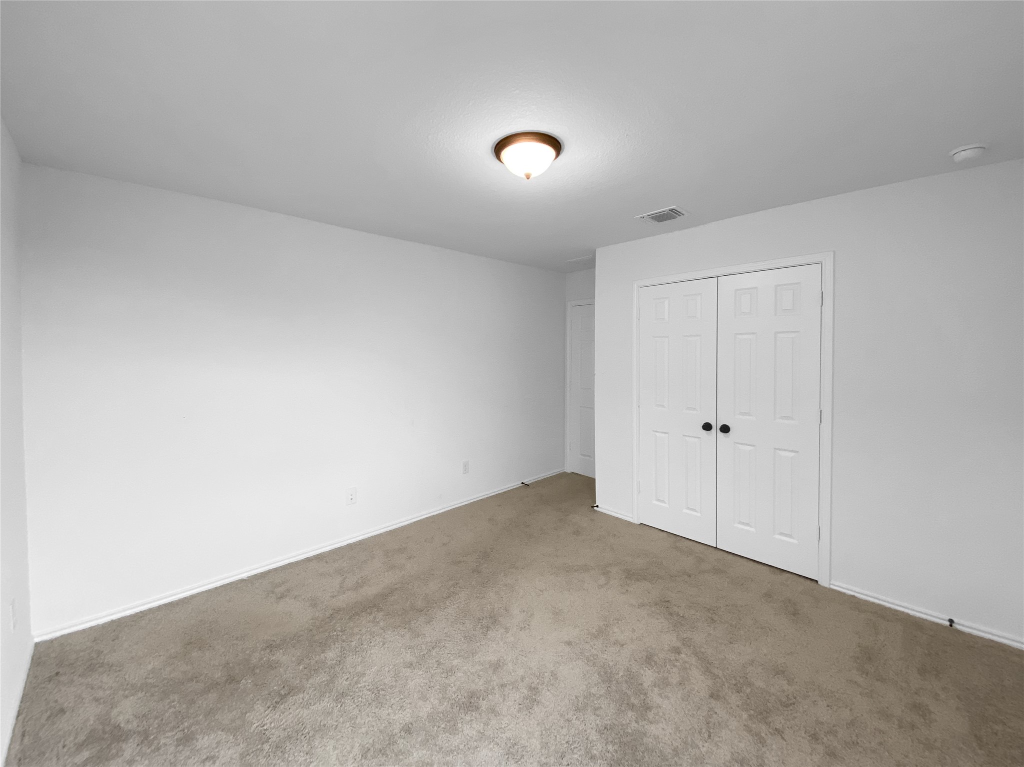 932 Yellow Ribbon Trail Jarrell, TX 76537 - Photo 13 of 26 Unfurnished bedroom featuring carpet and a closet