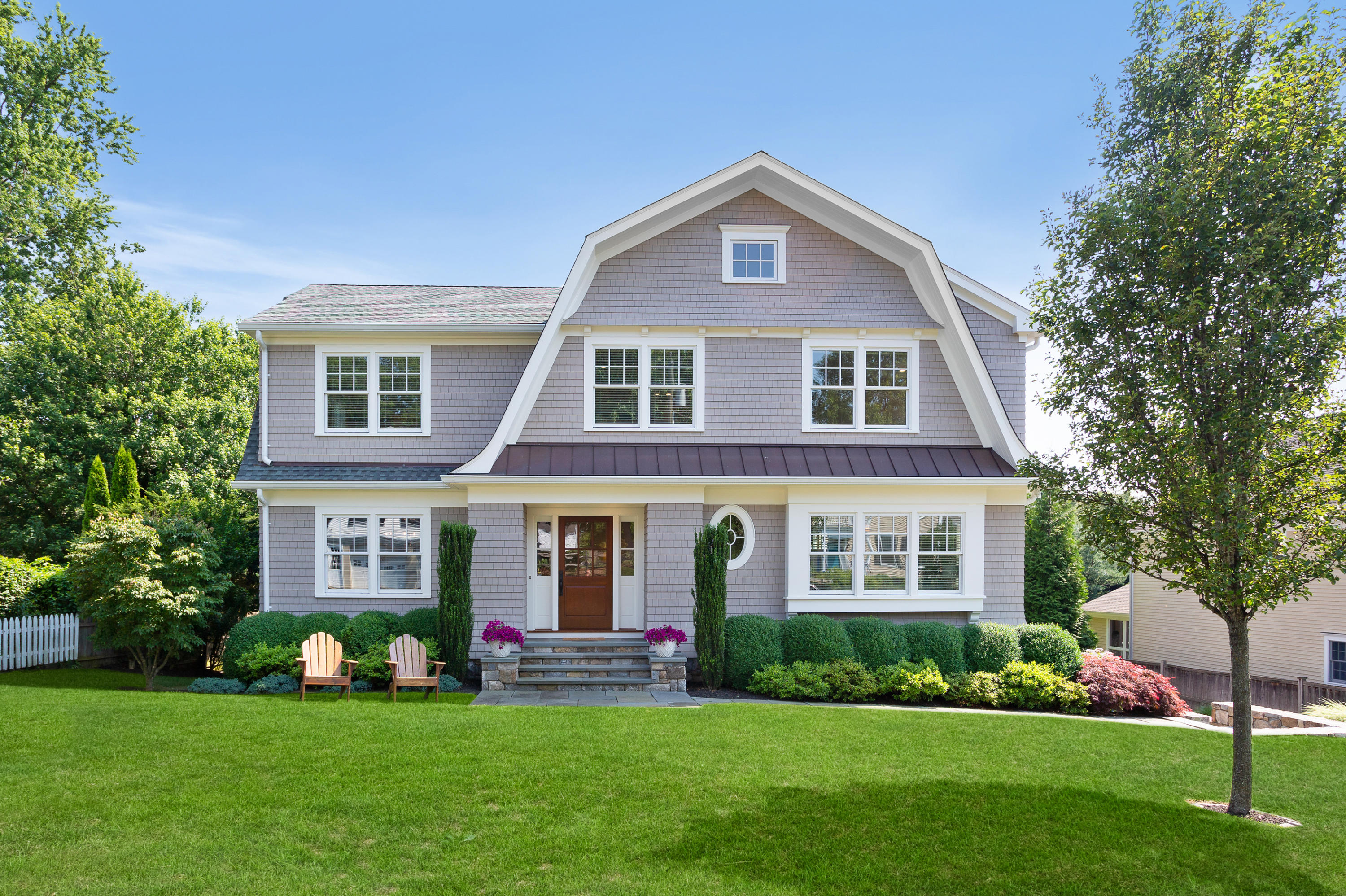 a front view of a house with a yard