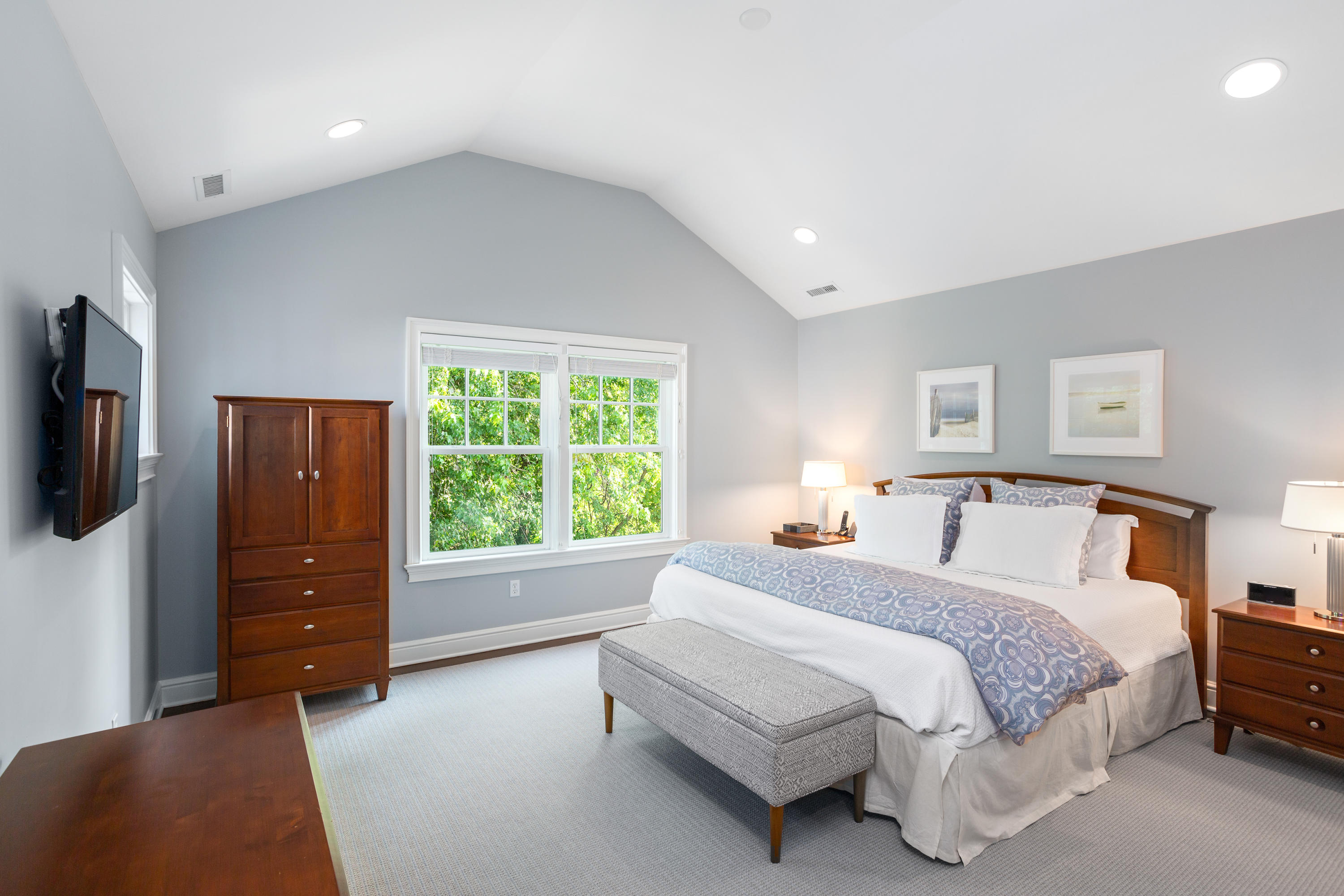 9 Concord Lane Darien, CT 06820 - Photo 18 of 36 a spacious bedroom with a bed and a television