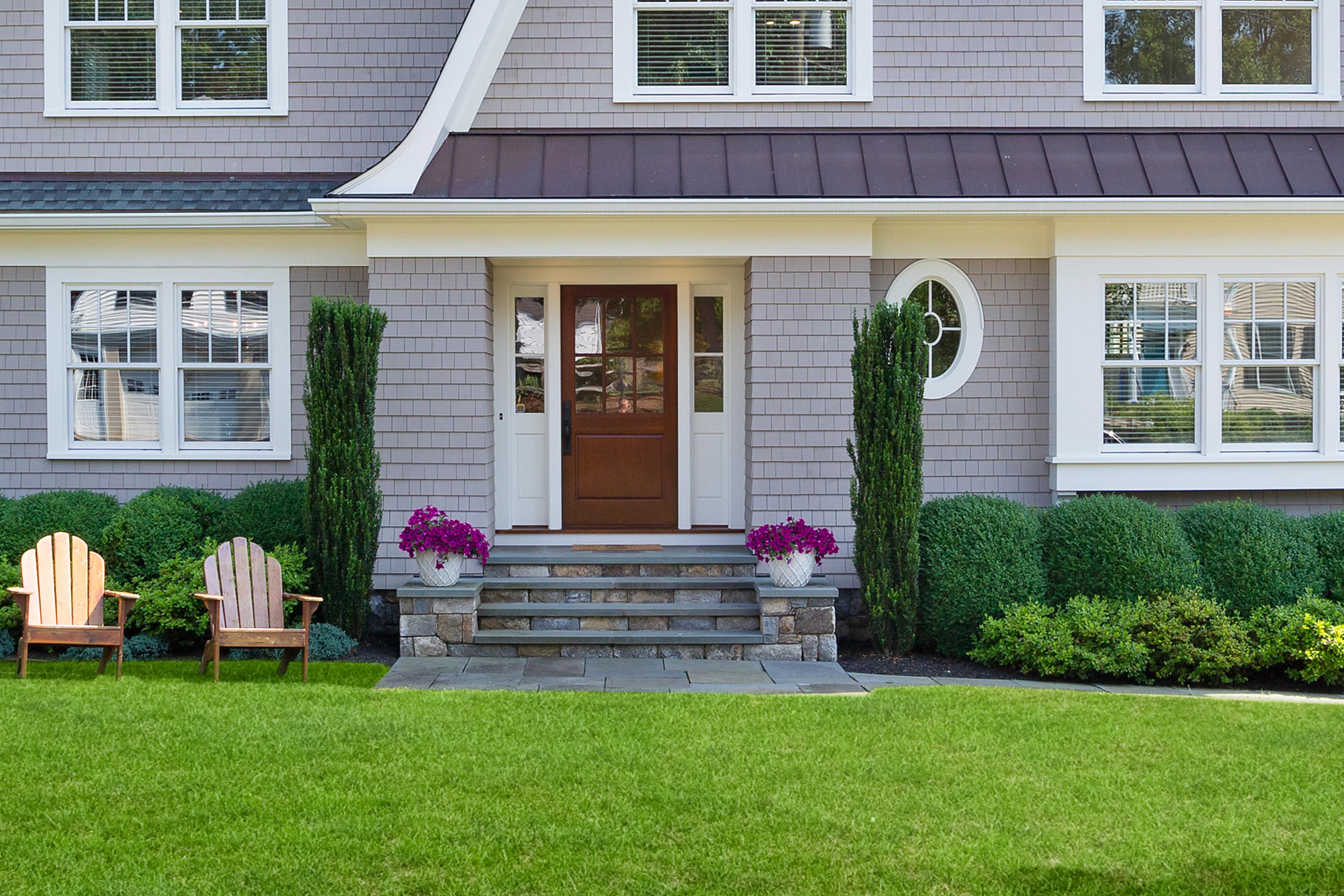 9 Concord Lane Darien, CT 06820 - Photo 2 of 36 a view of a house with potted plants and a table and chairs