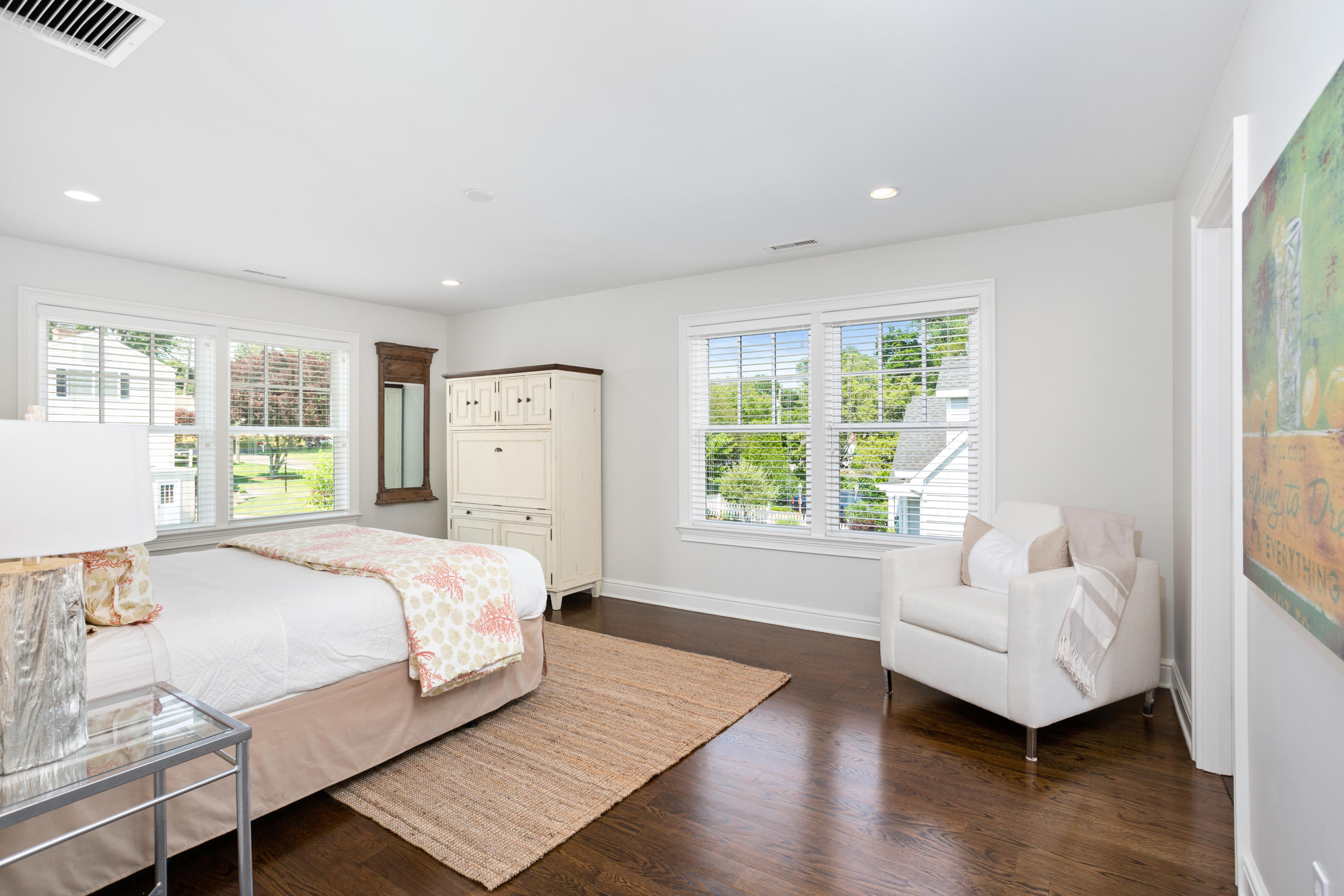 9 Concord Lane Darien, CT 06820 - Photo 22 of 36 a spacious bedroom with a large bed and a couch