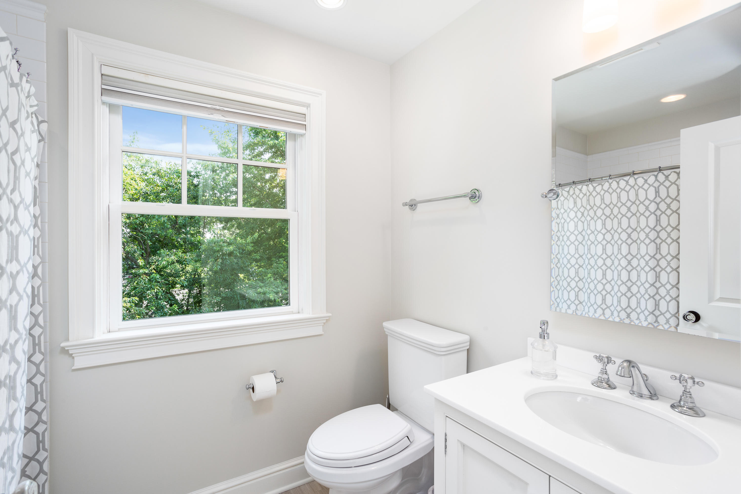 9 Concord Lane Darien, CT 06820 - Photo 23 of 36 a bathroom with a sink a toilet and a window