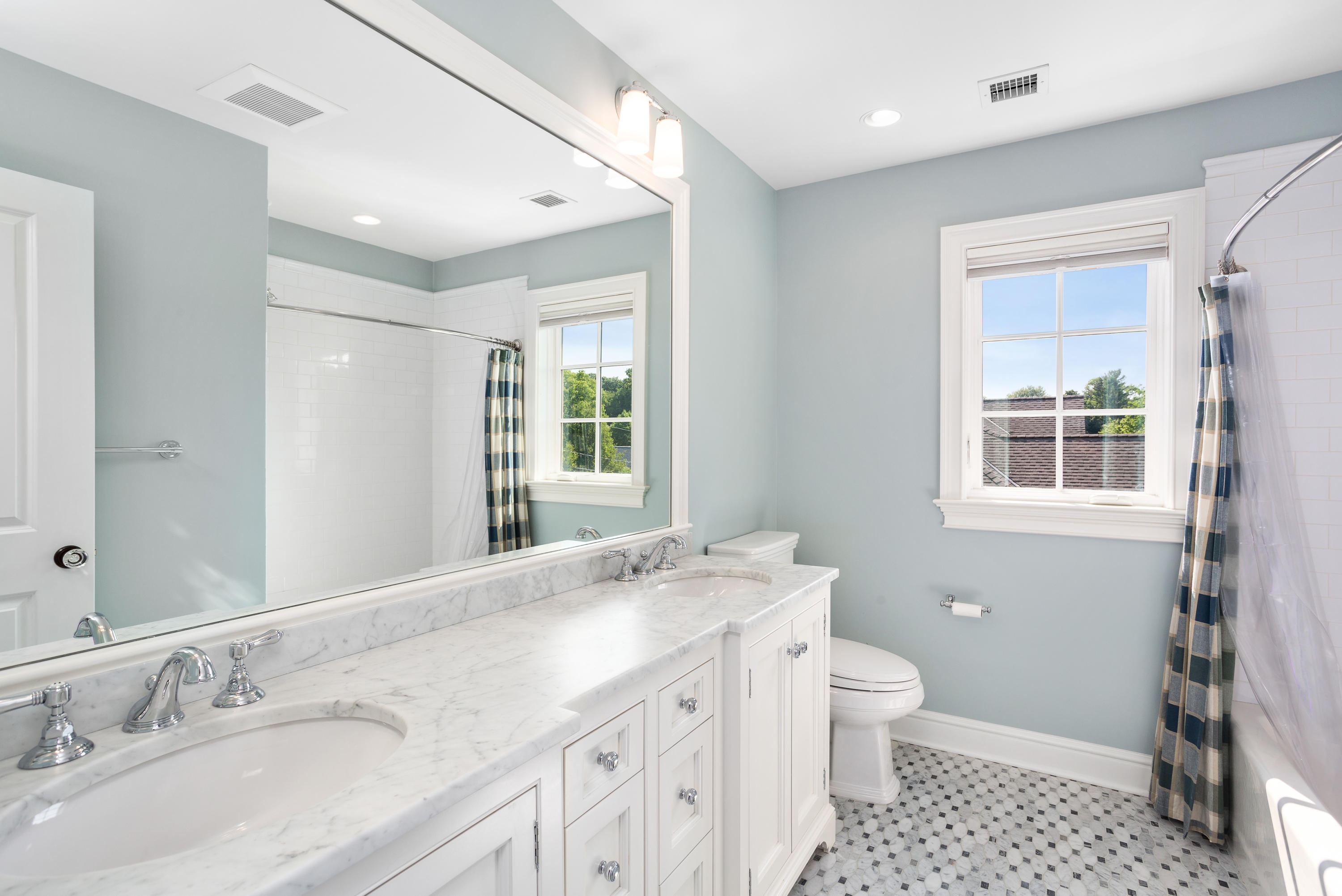 9 Concord Lane Darien, CT 06820 - Photo 26 of 36 a bathroom with a granite countertop sink a large mirror a toilet a shower and a window