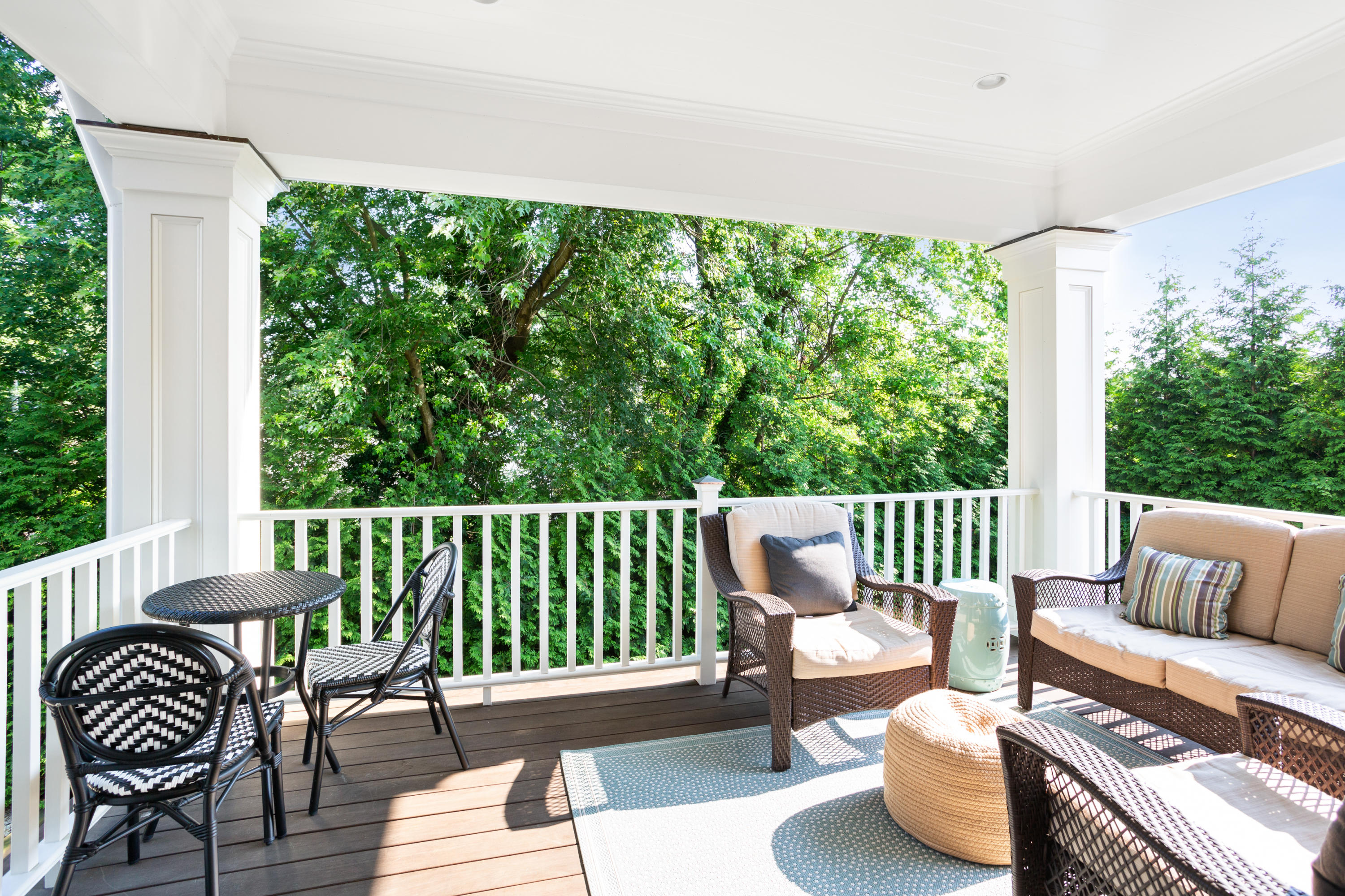 9 Concord Lane Darien, CT 06820 - Photo 27 of 36 a view of a patio with couches chairs and wooden floor