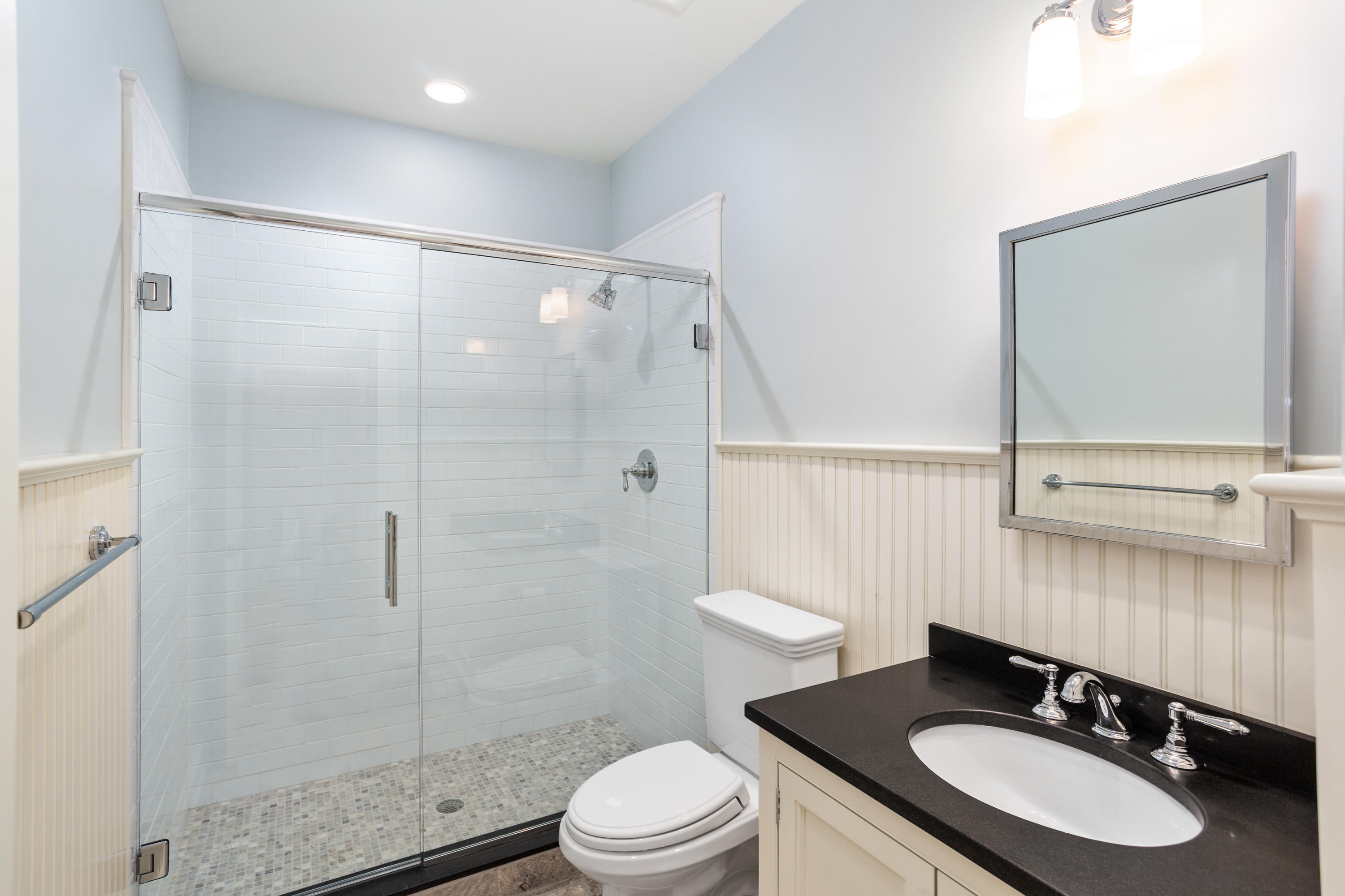 9 Concord Lane Darien, CT 06820 - Photo 31 of 36 a bathroom with a sink toilet a mirror and shower