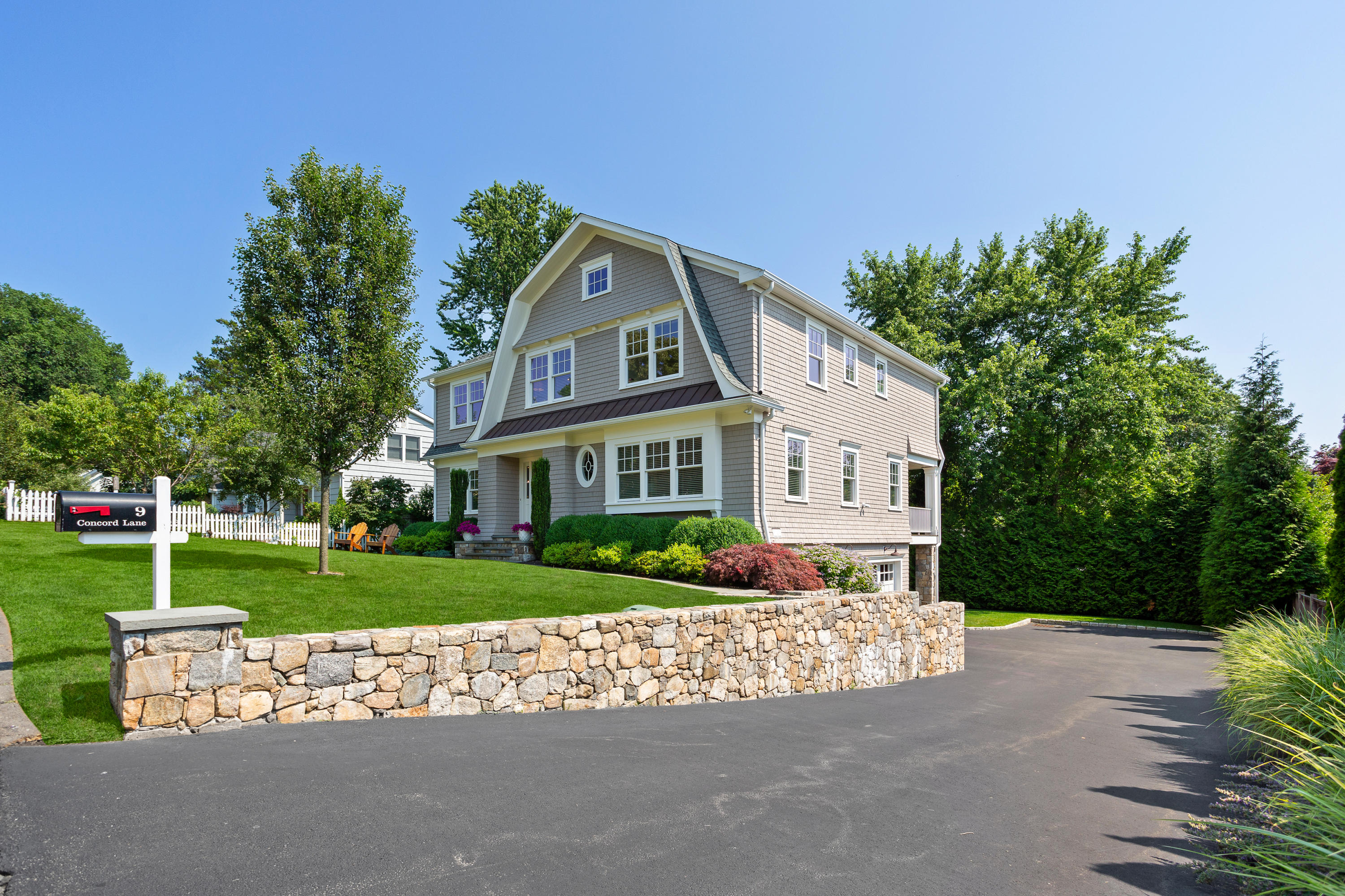 9 Concord Lane Darien, CT 06820 - Photo 36 of 36 a front view of a house with a yard