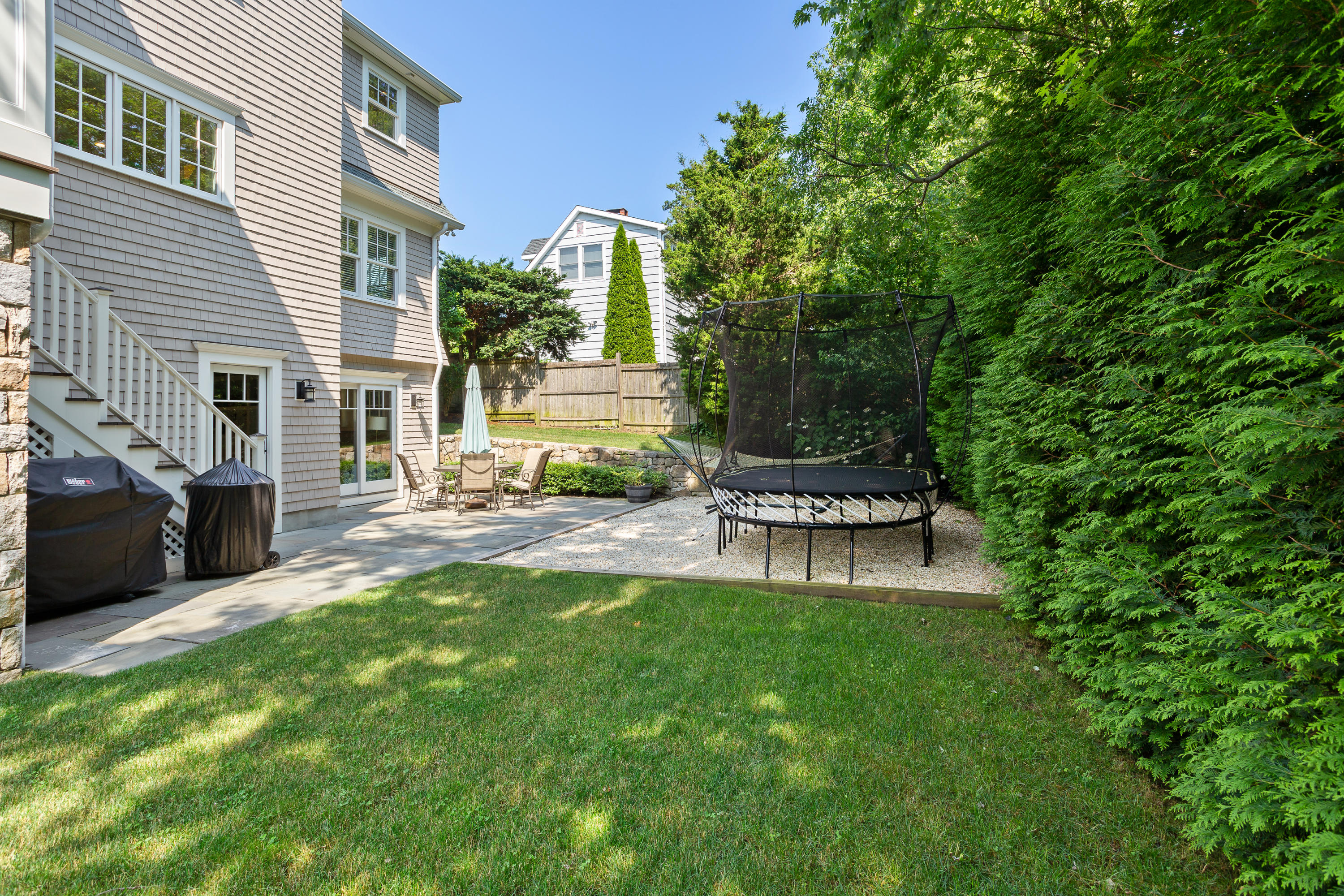 9 Concord Lane Darien, CT 06820 - Photo 4 of 36 a view of a house with a back yard