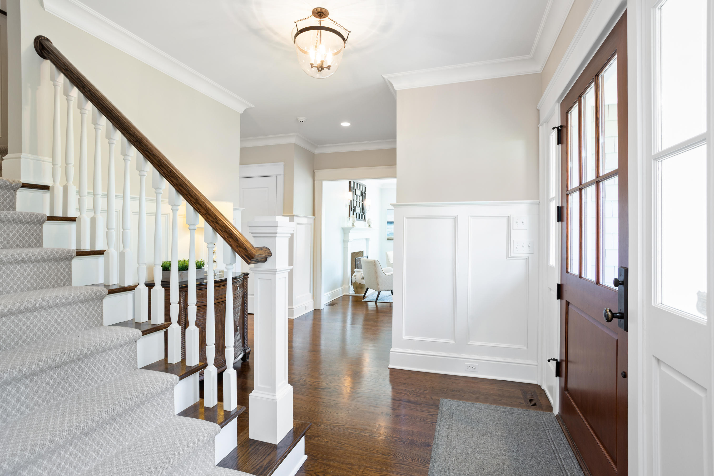 9 Concord Lane Darien, CT 06820 - Photo 5 of 36 a view of an entryway with wooden floor and stairs