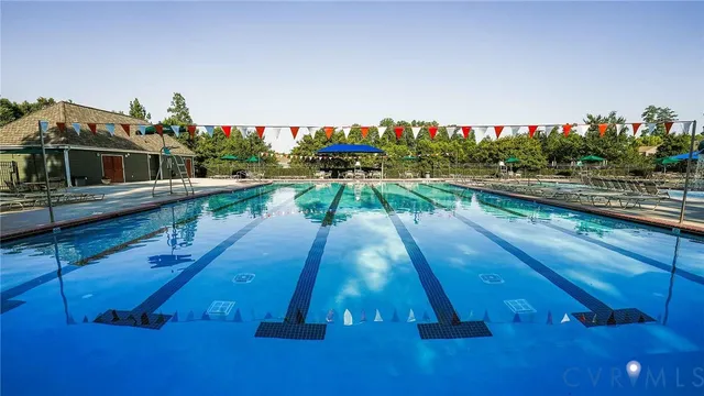 a view of a swimming pool with an outdoor seating